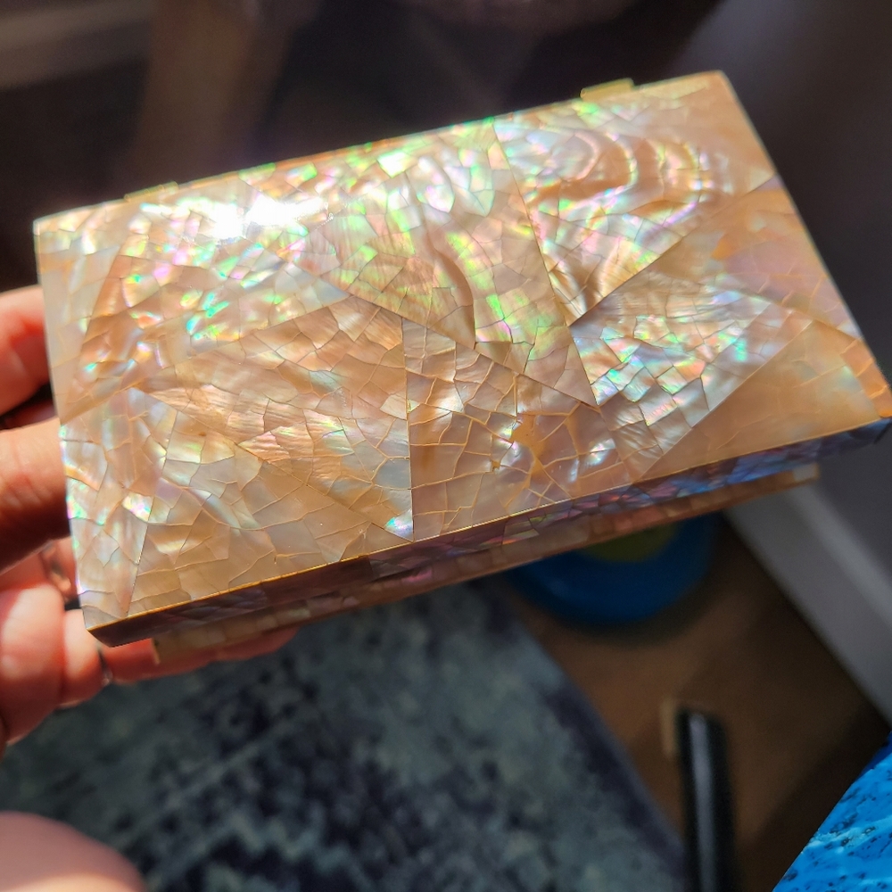 Jewelry box with beautiful shell inlay and soft velvet like interior.